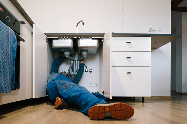 Professional Emergency Plumber technician working in Needham, IN